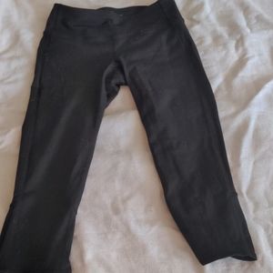Black Athleta Capri leggings with leg detail